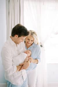 family poses with atlanta newborn photographer
