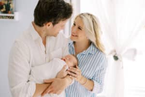 family poses with atlanta newborn photographer