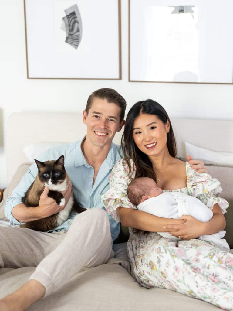 atlanta newborn photos, newborn session in dark home, newborn photos with cat